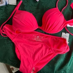 Brand New tags attached. Bright neon pink swim suit never worn.